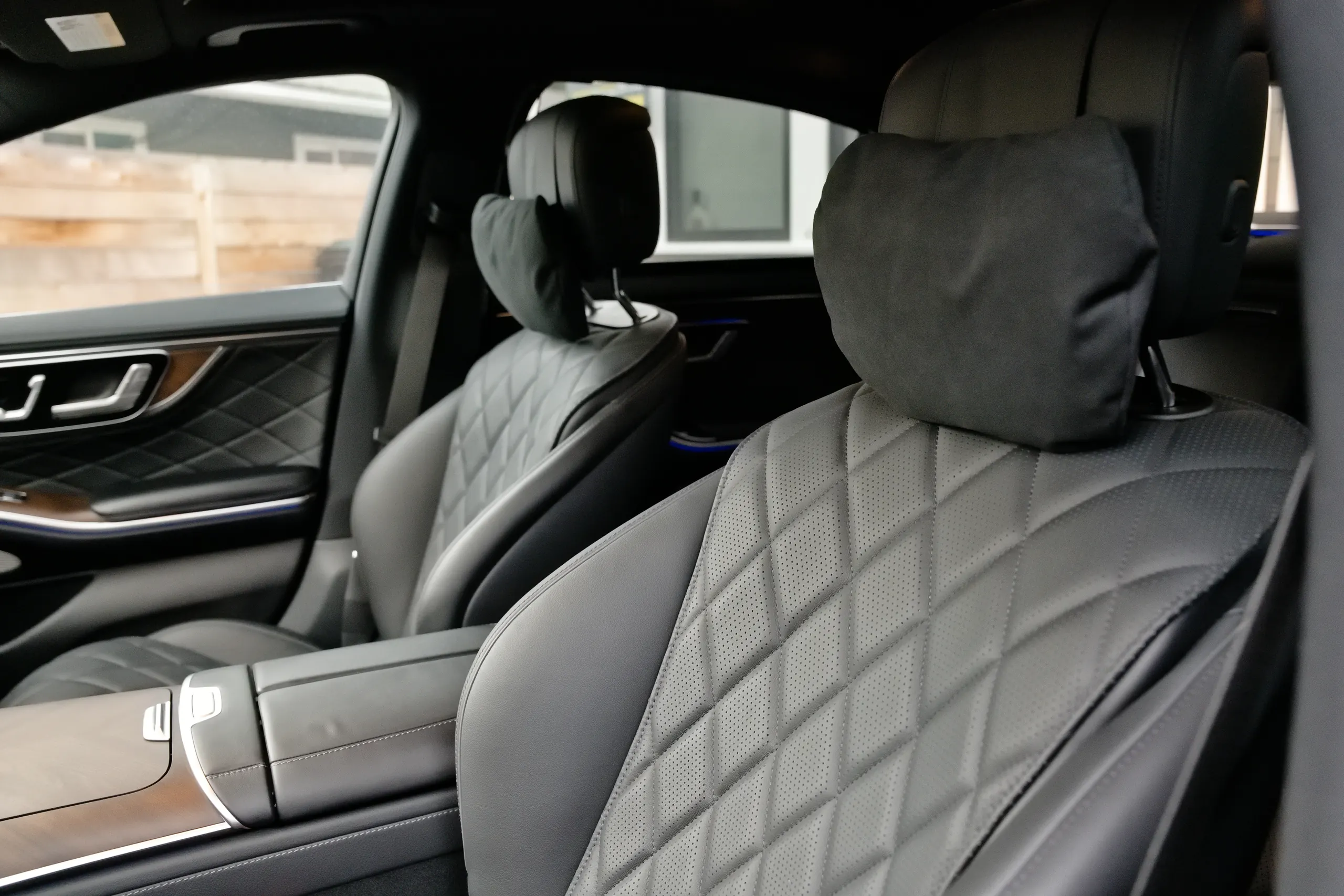 Quilted leather seats with headrest pillows inside the Mercedes-Benz S-Class first-class sedan